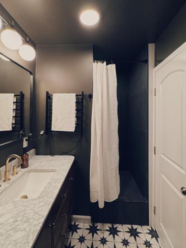 a bathroom with a sink and a shower at Evergreen Escape in Felton