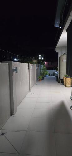 an empty hallway in a building with lights on at 77 Fulaga Flats in Suva