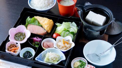 a tray of food with different types of food at Unzen Iwaki Ryokan in Unzen