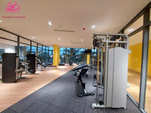 a gym with cardio equipment in a building at Lux Resort Apartment/2BR/Private Beach/Pools in Hà My Tây (2)