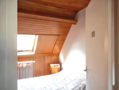 Posteľ alebo postele v izbe v ubytovaní Appartement familial à La Bourboule - 55 m² avec TV dans la chambre