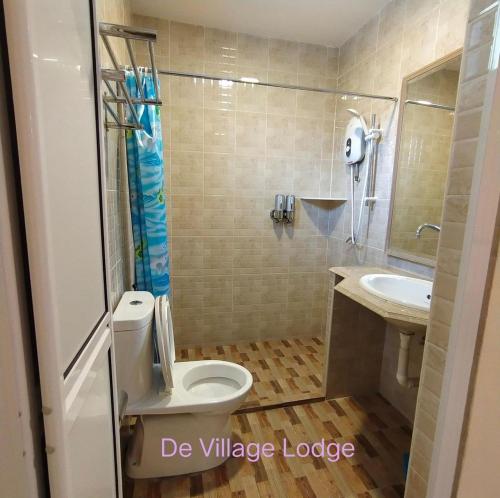 Koupelna v ubytování De Village Lodge
