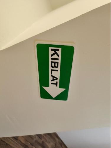 a green and white sign on a wall at Encorp Strand Suite by Luvit Stay in Petaling Jaya