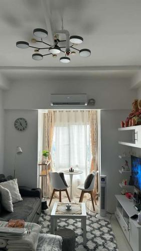 a living room with a couch and a table at Casa Uno in Manila