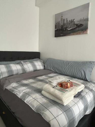 a bed with towels on top of it in a bedroom at Casa Uno in Manila