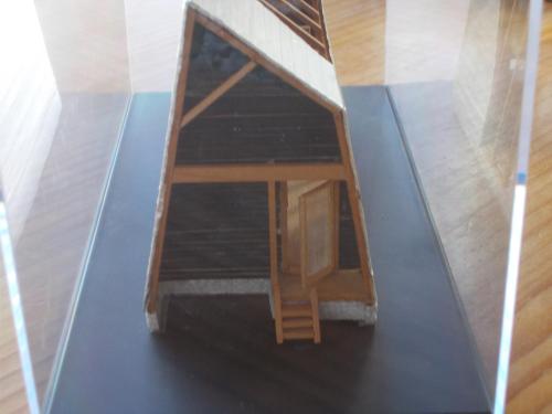 a doll house on a glass floor in a room at Niseko Shirokuma Cottage in Niseko