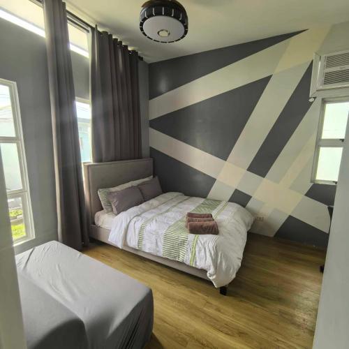 Postel nebo postele na pokoji v ubytování Davao City Airport Transient Rooms by Lemonique