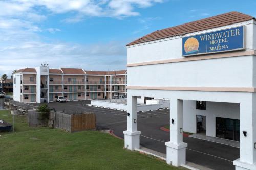 a view of a hotel with a parking lot at WindWater Hotel and Marina in South Padre Island