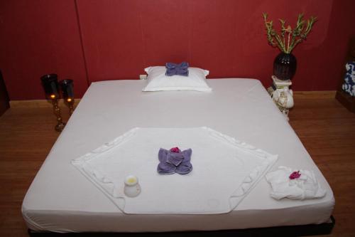 Postel nebo postele na pokoji v ubytování Ramee Rose Hotel