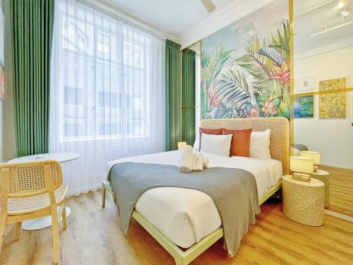 a bedroom with a bed and a large window at Studio 524- Stylish Urban Retreat on Central Queen Street in Auckland