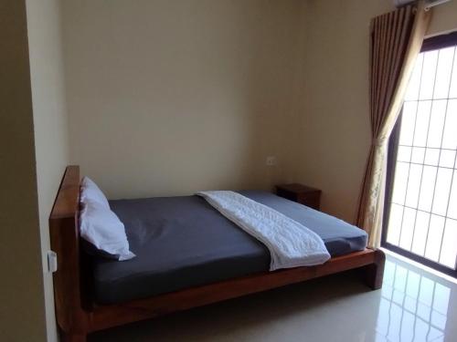 Postel nebo postele na pokoji v ubytování Hoa Dũng homestay