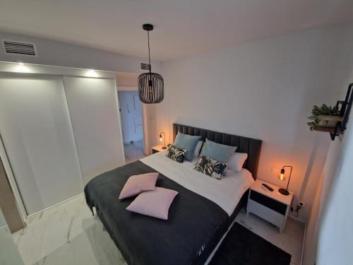 Ένα ή περισσότερα κρεβάτια σε δωμάτιο στο Penthouse Prestigio