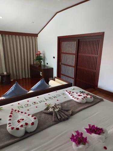 Postel nebo postele na pokoji v ubytování begonia N7 villa resort海棠7号别墅酒店