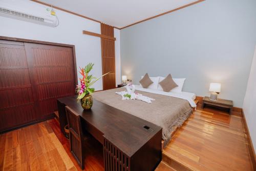 Postel nebo postele na pokoji v ubytování begonia N7 villa resort海棠7号别墅酒店