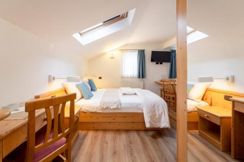 Postel nebo postele na pokoji v ubytování Albergo Negritella