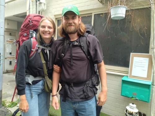 a man and a woman posing for a picture at TONARINO Hostel for Backpackers in Kobe