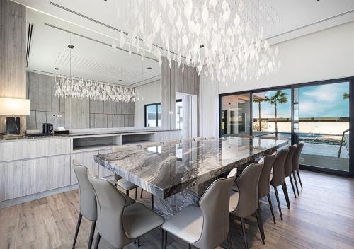 a large dining room with a long table and chairs at Montana Luxury Villa - Masfoot Hatta in Hatta