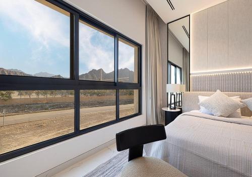 Кровать или кровати в номере Montana Luxury Villa - Masfoot Hatta