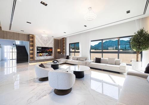 a large living room with couches and tables at Montana Luxury Villa - Masfoot Hatta in Hatta