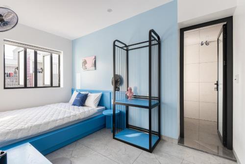a bedroom with a bed and a glass shower at GARE D'47 l 21 Lê Chân street l Đối diện Nhà hát lớn in Hai Phong