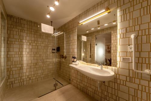 a bathroom with a sink and a mirror at Estate Spa Boutique Hotel - Adults Only in Rechovot