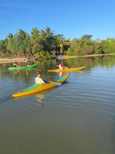 a group of people kayaking on a river at Hanguk Lanka Lagoon Villa in Tangalle