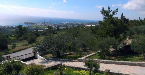a view of the ocean from a hill at Villa Panorama in Makry Gialos