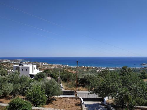 a view of the ocean from a house at Villa Panorama in Makry Gialos