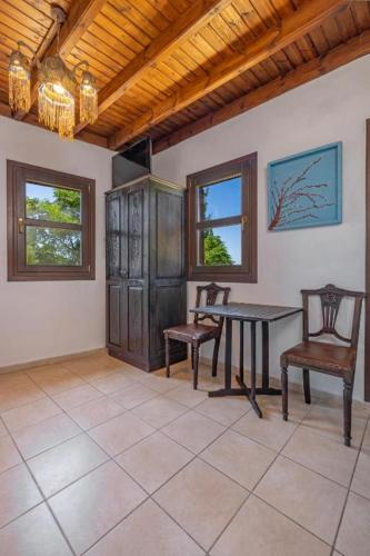 a dining room with a table and two chairs at Saint Michel Hotel in Rhodes Town