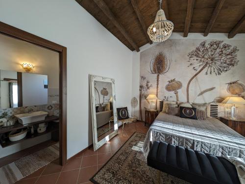 a bedroom with a large bed and a mirror at Passo del Mattino in Locati