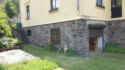 a dog standing in front of a brick building at FW-Talblick in Annaberg-Buchholz