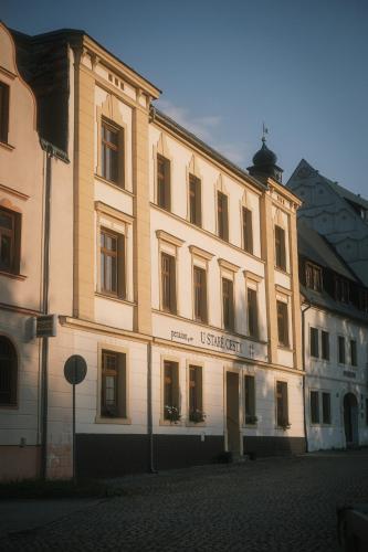 a large building on a street in a city at U staré cesty in Horní Slavkov