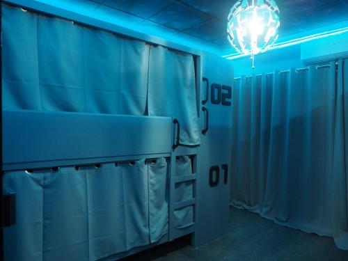 Katil atau katil-katil dalam bilik di Doctor Alien Hostel Don Mueang