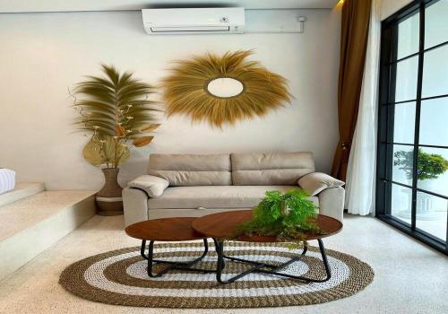 a living room with a couch and a table at Sampai Villa Teras Breksi in Randugunting