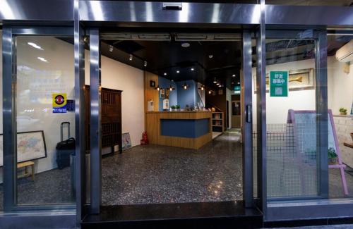 an open door of a store with a counter at 鄉都文旅 in Jiaoxi