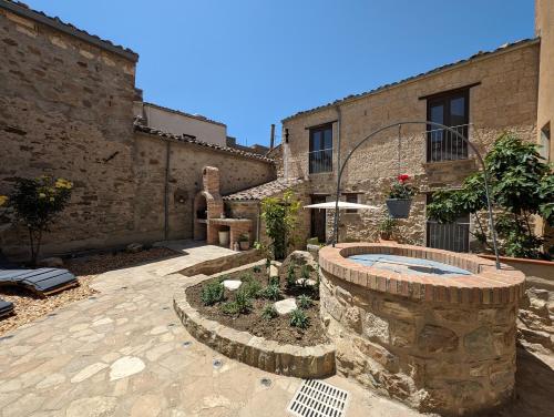 a courtyard with a pool in a building at Passo del Mattino in Locati