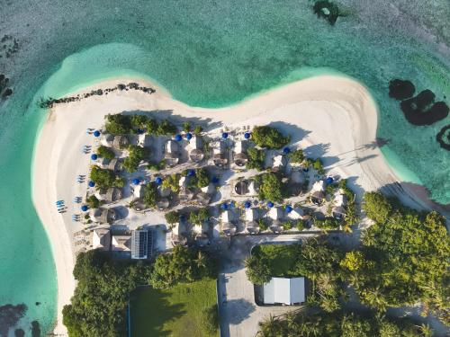 an aerial view of a resort on a beach at The MAVERICK SURF AND DIVE BOUTIQUE HOTEL - Book 10 Nights and get 1 Free Night - Free Speed Boat Service - Kids Stay Free in Laamu