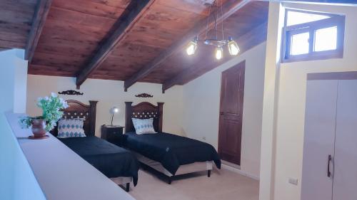 Ένα ή περισσότερα κρεβάτια σε δωμάτιο στο Casa Totó