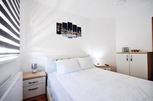 Ένα ή περισσότερα κρεβάτια σε δωμάτιο στο Apartman Cvetkovic