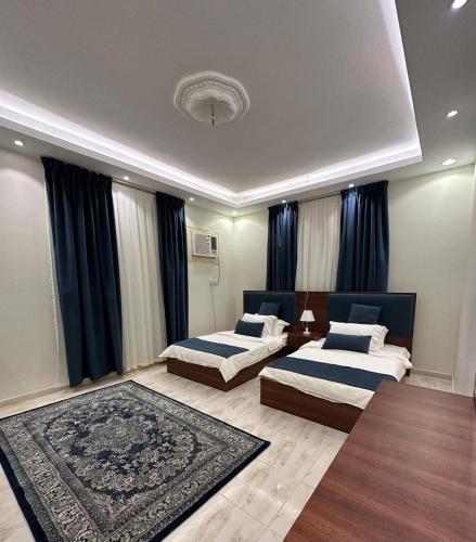 Ein Bett oder Betten in einem Zimmer der Unterkunft Almadinah Suite