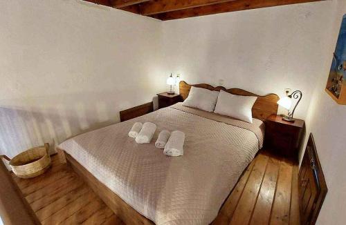 a bedroom with a bed with two towels on it at Saint Michel Hotel in Rhodes Town