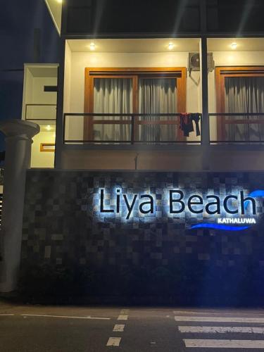 a lit up sign on the side of a building at Liya Beach Kathaluwa - Ahangama in Ahangama
