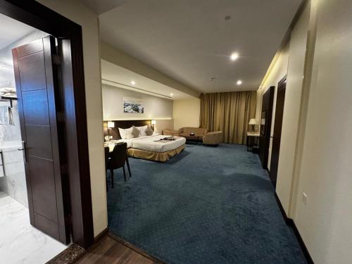 Postel nebo postele na pokoji v ubytování Coupard Hotel