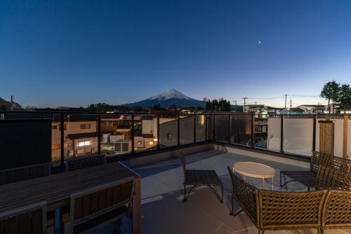 a balcony with a view of a mountain at Great Fuji Kawaguchiko in Fujikawaguchiko