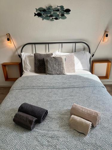 a bedroom with a bed with two pillows on it at Lisbon Woods House II in Lisbon