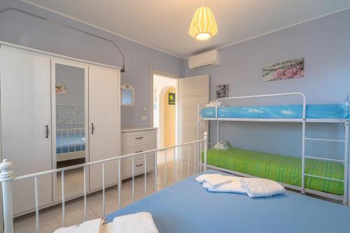 Postel nebo postele na pokoji v ubytování Villa Carla San Lorenzo