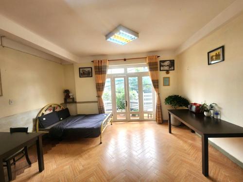 Postel nebo postele na pokoji v ubytování Đà Lạt Chay Guest House