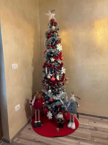 a christmas tree with stuffed animals around it at Amor, flat with private hot tub, breathtaking views and free parking in a garage, bookable all year round, Also take a look at our flat Coccolina in Rabac