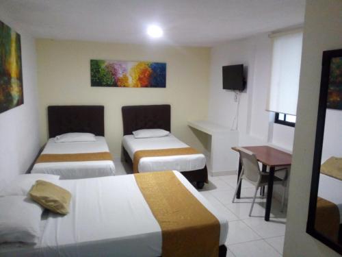 Hotel Parque del Perroにあるベッド