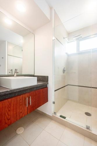 a bathroom with a sink and a shower at Experience tranquility and comfort accommodation, near main attractions in Riviera Maya in Lafitte